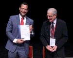 Head of SIMV Delegation displays MMoU Signature Form while IOSCO Secretary General watches 